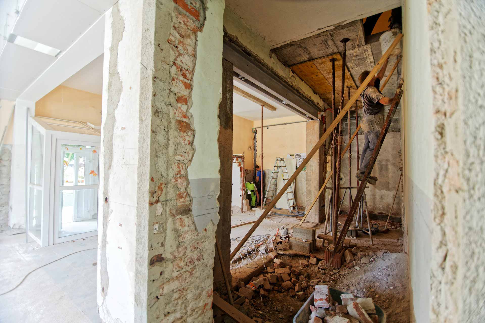 Demolition contractors at work in home interior